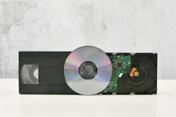 the evolution of the film. change of media. video cassette, disk, hard drive. close-up. place to write. The evolution of storage technology and media. Concept collage