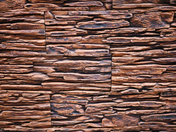 Fachada de pedra desigual close-up. Textura de pedra rasgada. Parede de pedra. Stonewall fundo abstrato — Fotografia de Stock