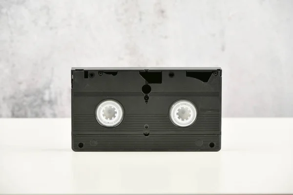 Videotape. Media pop culture of the 80s. video recording on a light background. View from above. Very Old Video Tape — Stock Photo, Image