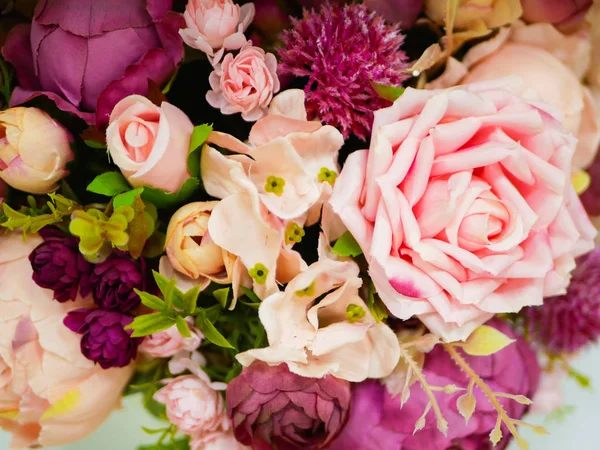 Bouquet of roses close-up. A bouquet of beautiful wedding flowers, pink roses.