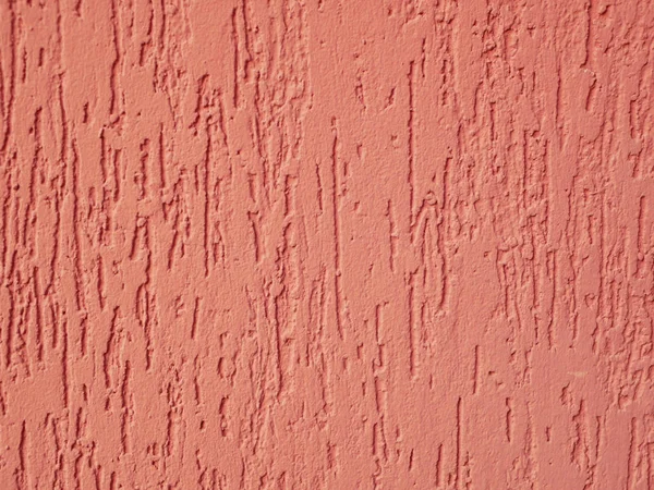 Orangefarbene Fassade aus nächster Nähe. Textur. Injektion von Farbe auf das Haus. — Stockfoto