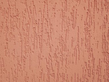 Turuncu cephe, yakın plan. Doku. Eve boya enjekte edilmiş..