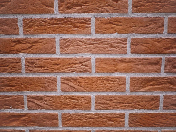 오렌지 색 벽돌 전면. 찢어진 돌 질감. 돌벽. 추상적 배경 — 스톡 사진