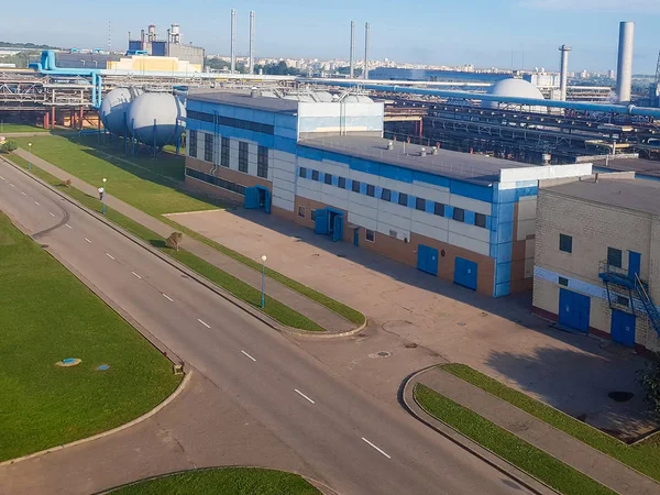 workshops of a chemical plant. Chemical plant for the production of ammonia and nitrogen fertilizers. Ion for the daytime. The pipeline connecting the factory floor. boiler room, power supply departme