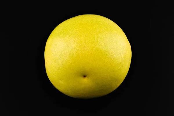 Pomelo on a black background. Place for an inscription. Easy cut. View from above. close-up. — Stock Photo, Image