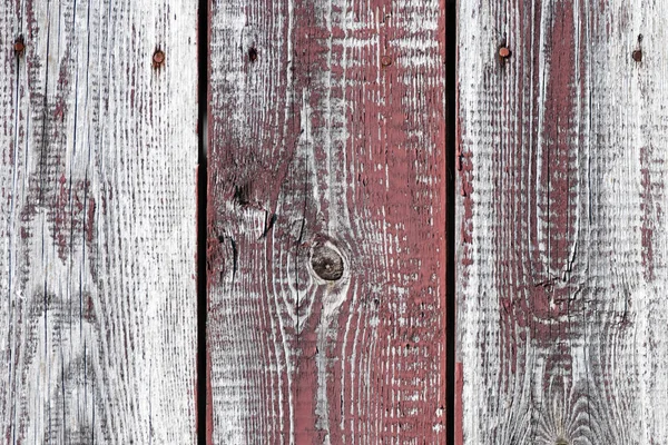 Red-gray wooden background. vertical boards. old paint peels off. old boards. Red gray wood texture of a worn painted board. Red gray wood texture of old worn painted board — Stock Photo, Image