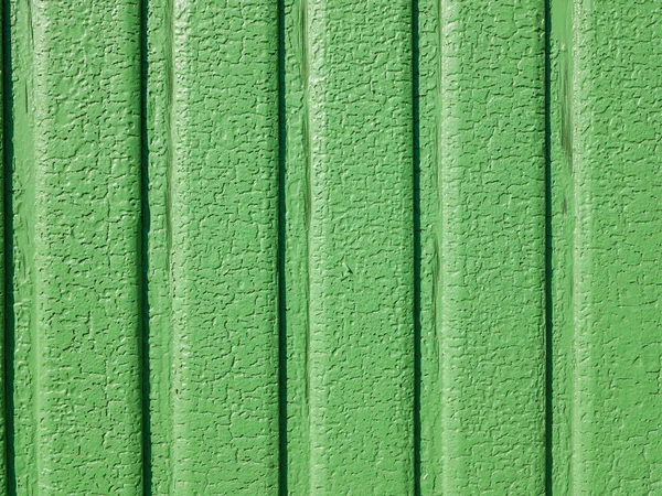 Green paint cracked. in sunny weather the iron gate. vertical lines — Stock Photo, Image