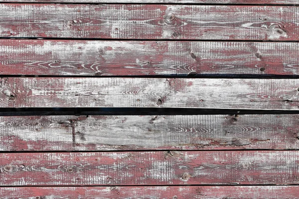 Latar belakang kayu merah-abu-abu. Papan horizontal. Kulit cat tua. Papan tua. Tekstur kayu abu-abu merah dari papan cat usang. Tekstur kayu abu-abu merah dari papan yang sudah usang — Stok Foto