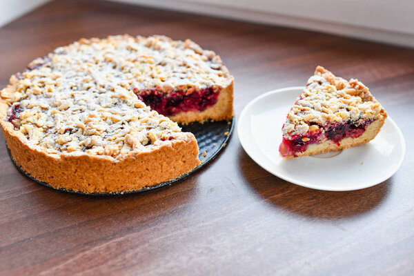 homemade berry pie. round shapes. Closeup homemade berry pie with meringue on white wooden table. Top view 