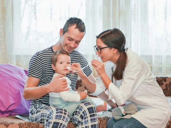 stuffy nose in a child. procedure for the nose. doctor and snotleosos. the doctor is at home. call the address. Doctor on call. Father called the doctor to the house. Father on maternity leave.