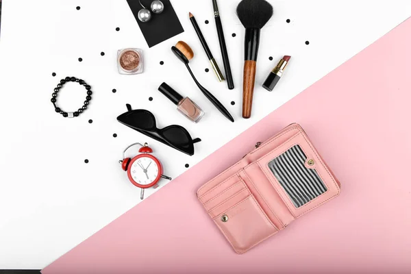 concept female shopping, flat lay. flatlay. Flat lay female accessories cosmetics, phone earphones alarm clock on a pink background. Valentine's Day March 8th. Top view of women's accessories. shoppin