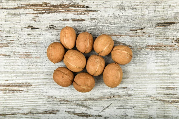 walnuts in the hands. Close up view of walnuts in her palm. Walnuts are 4 water, 15 protein, 65 fat and 14 carbohydrates, including 7 dietary fiber. In a reference portion of 100 grams.