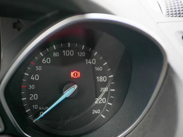 Error indicator on the car speedometer. Colorful error sign on a car dashboard. Need a car service. Car breakdown — Stock Photo, Image