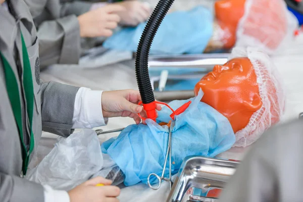 Medical pump for air supply to the lungs. Interest in medicine in children. Children in medical coats. Medical training. KHARKOV, UKRAINE - JANUARY 20, 2020