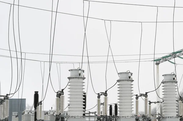 City electrical substation, close-up, transformer with high-voltage wires.