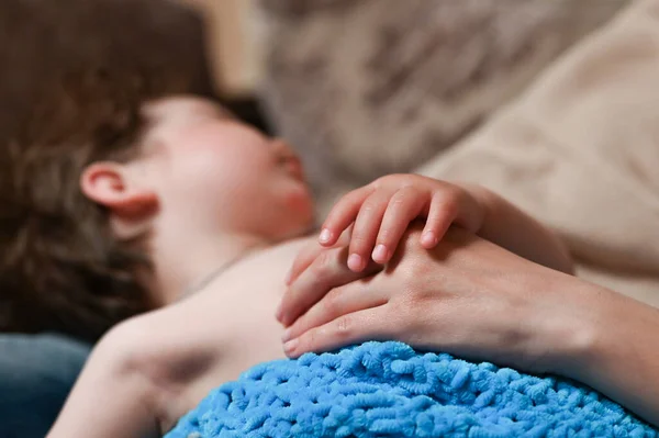 Baby Holds Mother Hand While Sleeping — стоковое фото