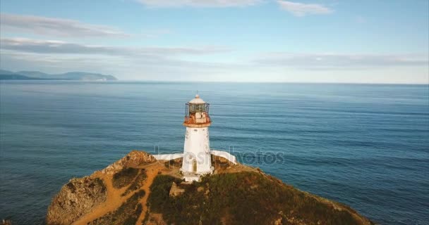 Aerial panoramic view of cliff with lighthouse Brinera. Aerial. Russia — Stock Video