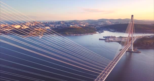 Flying above Russian Bridge. Russian island is on background. Sunrise. Russia — Stock Video