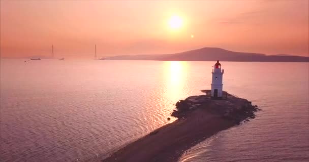 Flying above sandy way to Tokarevsky lighthouse at sunrise and its aerial view — Stock Video