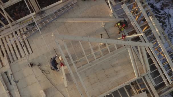 Aerial View Builders Adjusting Planks While Working Second Floor New — Stock Video