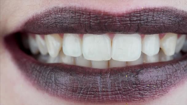 Macro View Female Lips Black Lipstick Showing Perfect White Teeth — Stock Video