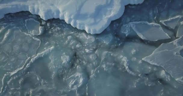 Aerial Top View Sea Surface Snowy Ice Floes Moving Sea — Stock Video