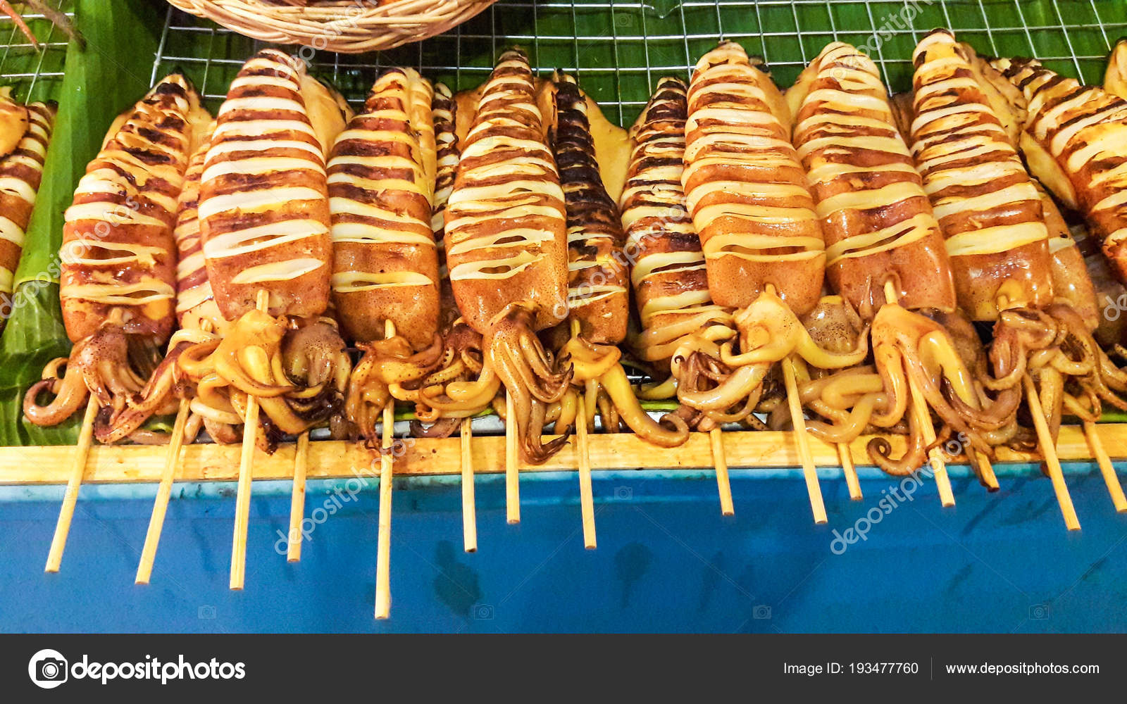 photo Grilled Squid On A Stick https depositphotos com 193477760 stock photo grilled squid stick wood matal html