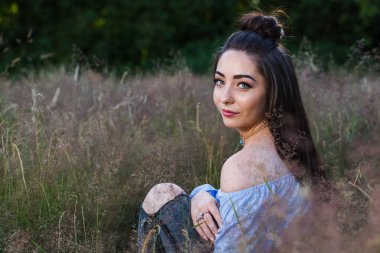 Looking over her shoulder