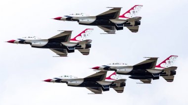 Closeup of The Thunderbirds in tight formation clipart