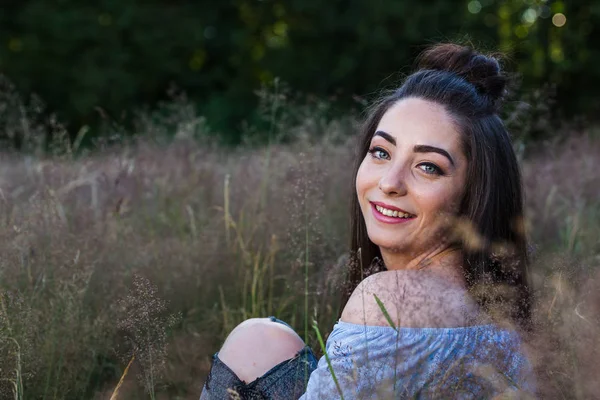 Looking over her shoulder