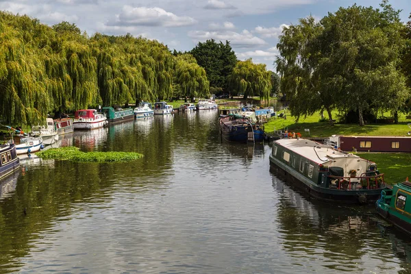 Boats line the river side of the River Great Ouse
