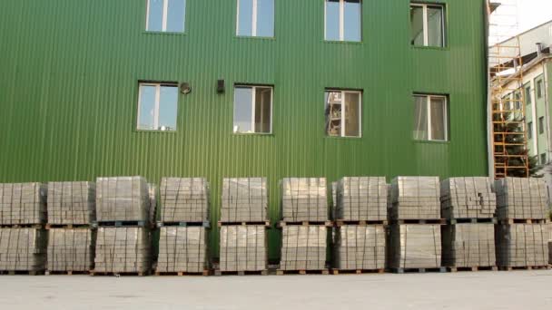 Pan Shot Stacks Paving Stones Wrapped Construction Film Stored Outdoors — Stock Video