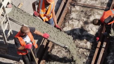 Sochi, Krasnodar Territory, Russia, seaport, 10/09/2019. workers repair the railway pour concrete mixture between the rails