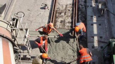 Sochi, Krasnodar Territory, Russia, seaport, 10/09/2019. workers repair the railway pour concrete mixture between the rails