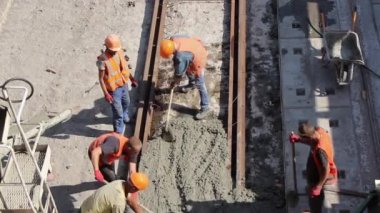 Sochi, Krasnodar Territory, Russia, seaport, 10/09/2019. workers repair the railway pour concrete mixture between the rails