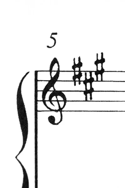 A music score sheet with the focus on the G-clef — Stock Photo, Image