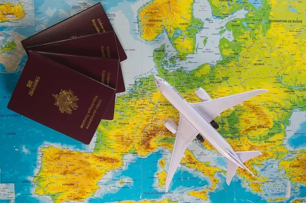 French passports on map and plane background — Stock Photo, Image