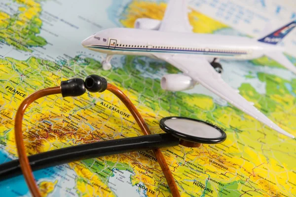 Stethoscope on map medical concept tourism travel care — Stock Photo, Image