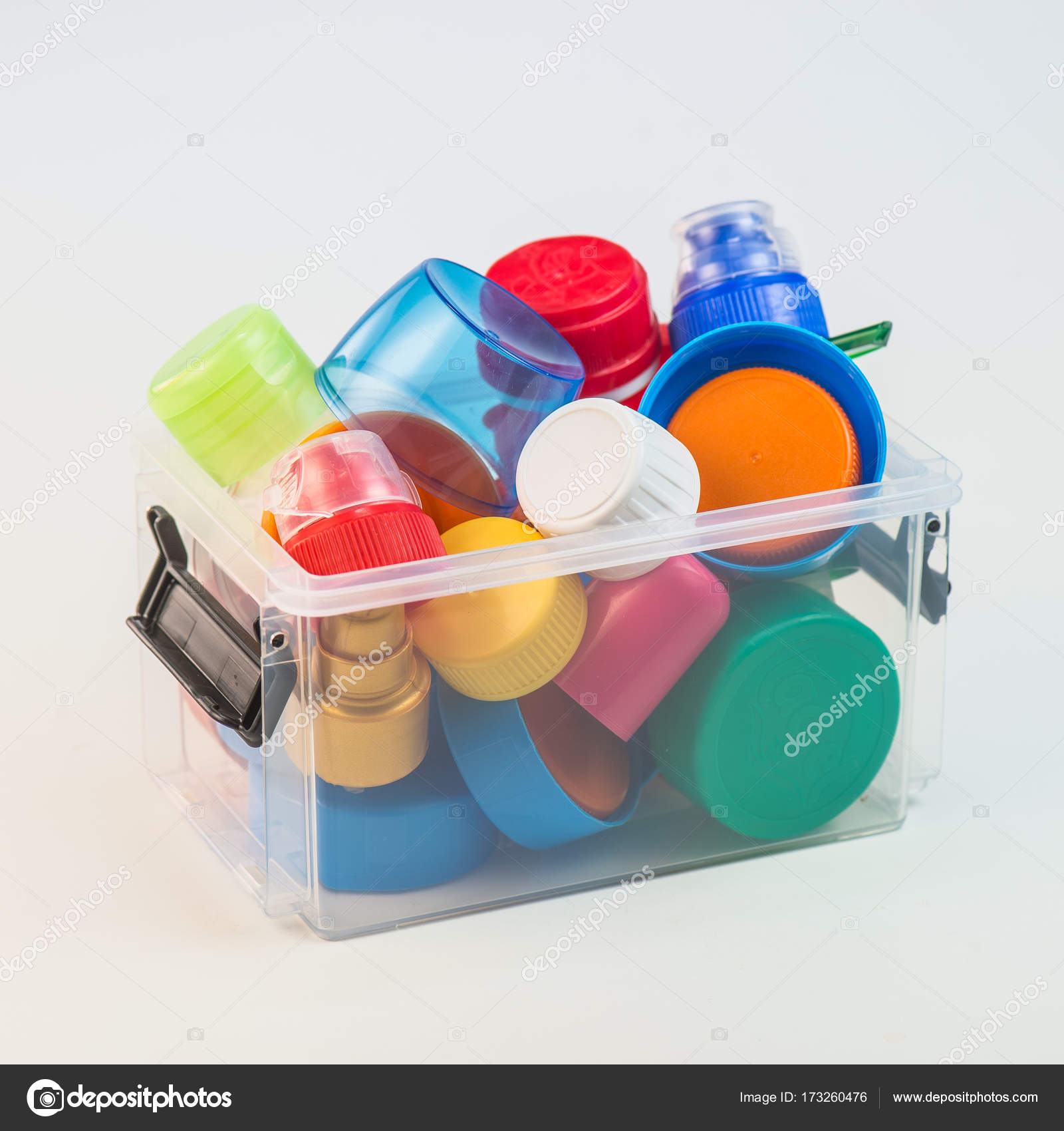 Plastic bottle screw caps in box isolated on white — Stock Photo