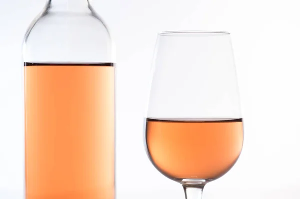 Rose wine glass and bottle on white background — Stock Photo, Image