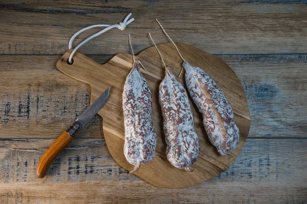 French salami Sausage on a wooden table — Stock Photo, Image