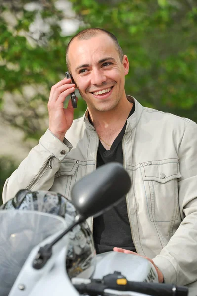 Young man with motorcycle — Stock Photo, Image