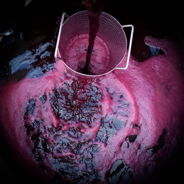 Wine mixing during fermentation process in barrel, Bordeaux Vineyard — Stock Photo, Image