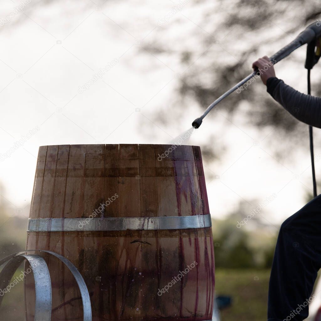 High pressure cleaning after Wine mixing and fermentation process in barrel, Bordeaux Vineyard