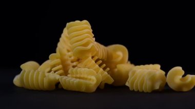 Close up video rotation vermicelli pasta on black background