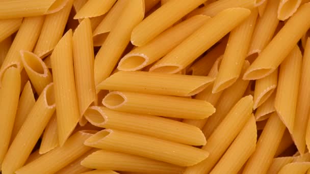 Pile of raw italian pasta rotating — 비디오
