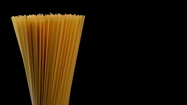 Spaghetti rotating on black background — Stok video