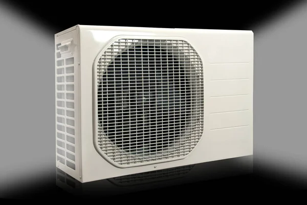 air conditioner to heat the house in winter and cool it in summer on a colored background