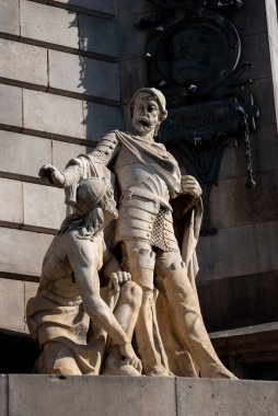 Bir heykeli temsil eden taş ve bronz heykel.