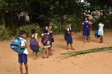 Village children in India going to school in the morning